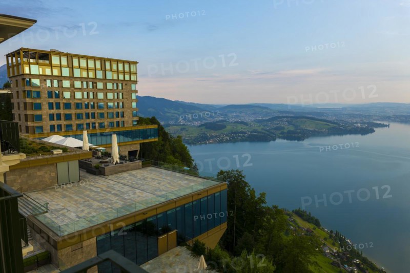 Hotel Five Stars Buergenstock over Lake Lucerne and Mountain with Sunlight in Buergenstock