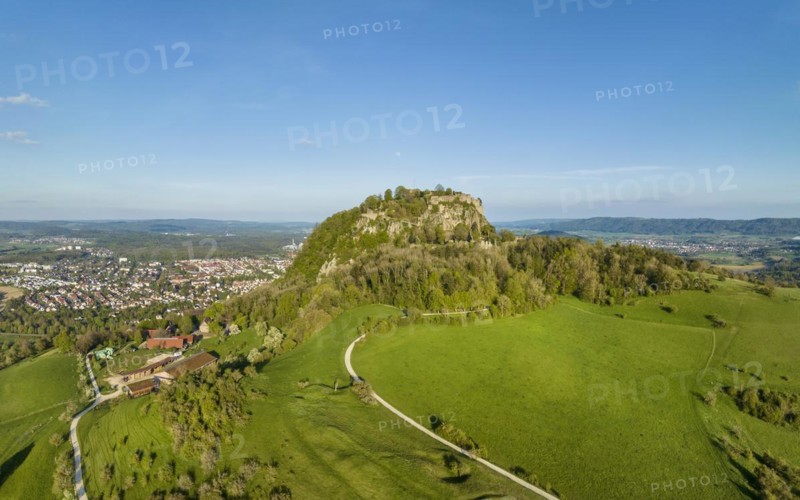 The volcanic cone Hohentwiel with the castle ruins illuminated by the evening sun