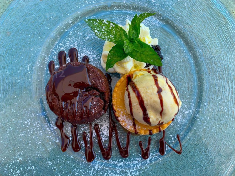 Chocolate Souffle Dessert with Ice Cream and Mint Blade on Plate in Switzerland