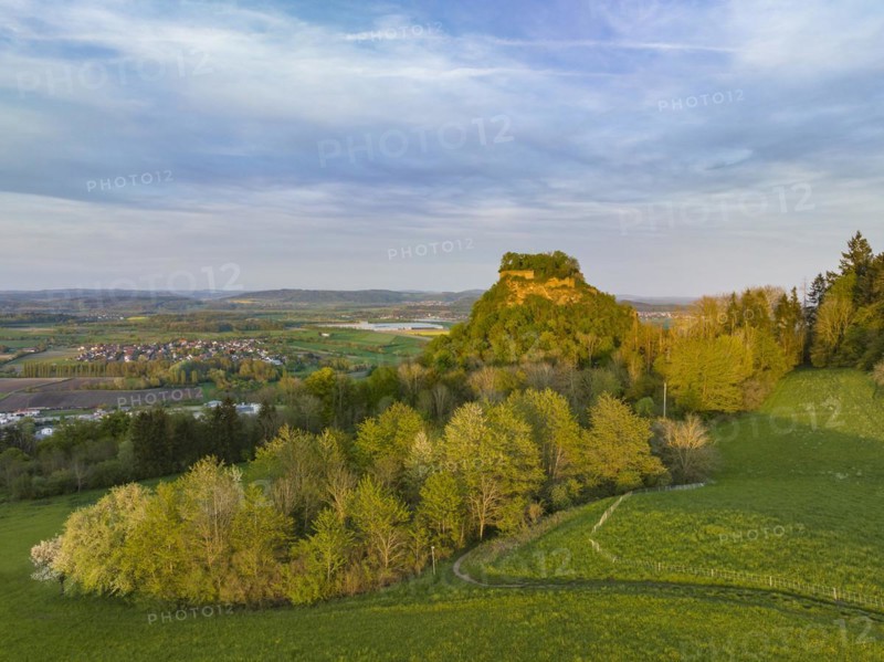 The Hegau volcano Hohenkraehen illuminated by the evening sun