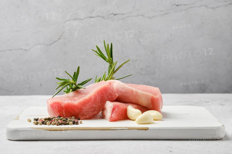 Slices of pork escalope on the table