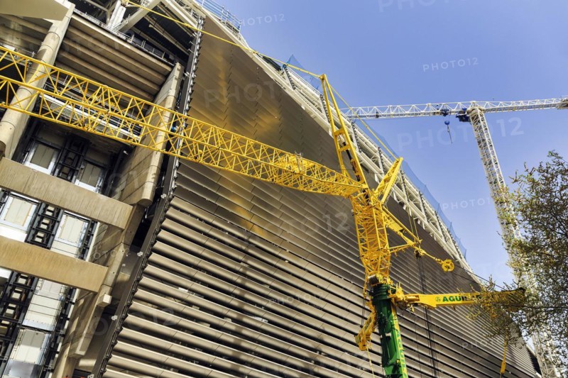 Construction crane in front of Real Madrid football stadium