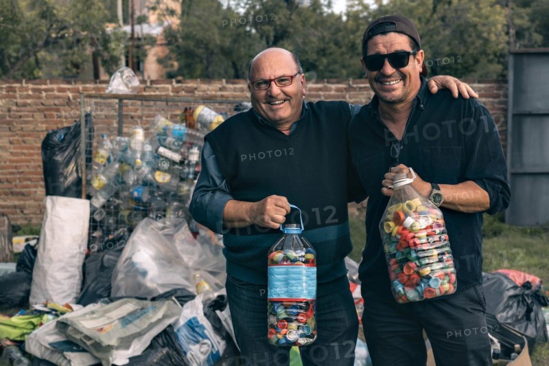 Two men at a neighborhood recycling center