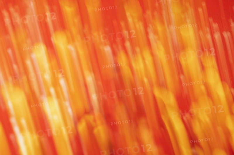 Red tone blurs the bokeh light. Defocused Red and orange holiday bokeh. Abstract christmas background