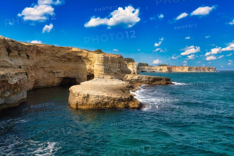 Rock stacks and crystal clear sea of the Faraglioni di Sant Andrea