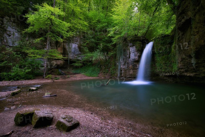 Waterfall in the forest with small pond near Kilchberg