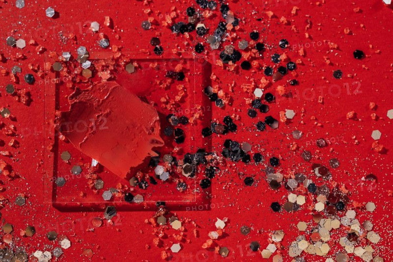 Cosmetics smear of smudged red lipstick