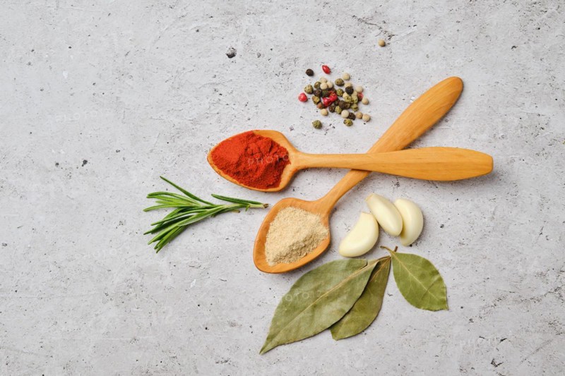 Top view of spice and herbs for cooking on concrete background