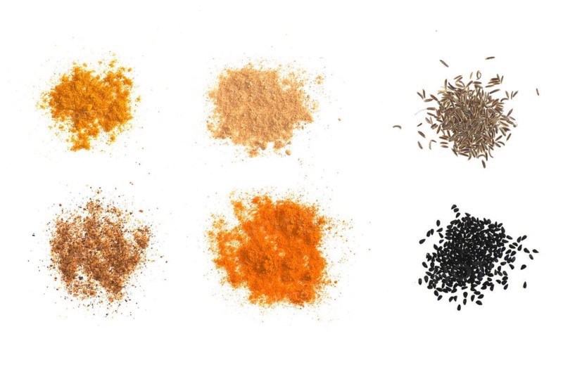 Many spices including Ginger Curry Turmeric Chili pepper Black cumin