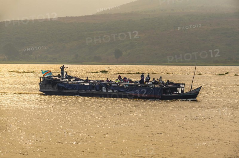 Overloaded riverboat on the Congo river