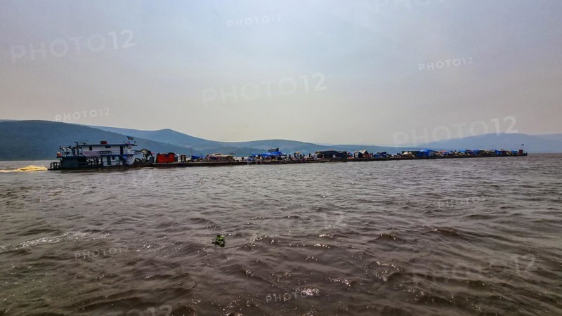 Overloaded riverboat on the Congo river