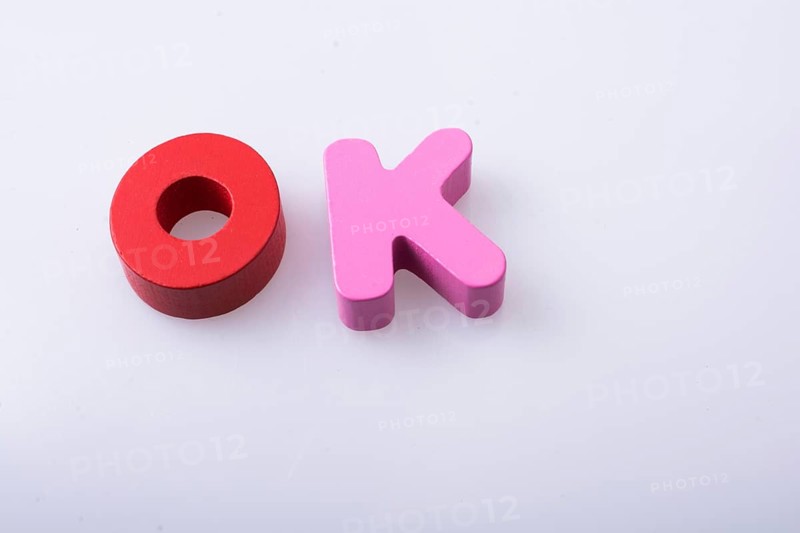 The word OK written with colorful letter blocks