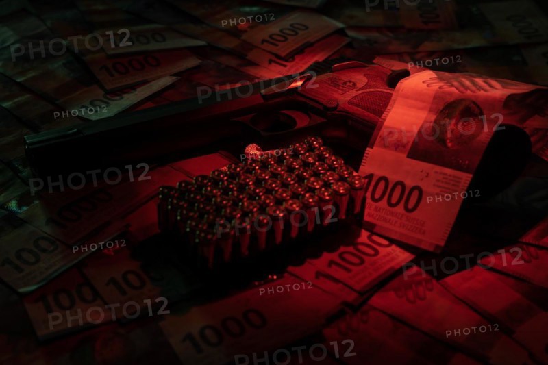 Elegant Semiautomatic 9mm Handgun with Swiss Helvetia Symbol Leaning on Swiss Franc 1000 Banknote and Bullet Ammunition in Switzerland