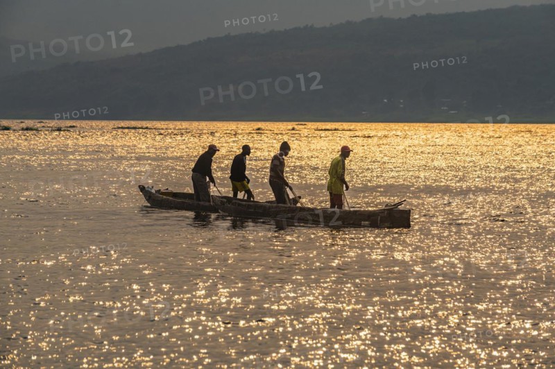 Fishermen at sunset on the Congo river