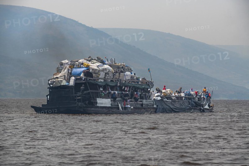 Overloaded riverboat on the Congo river