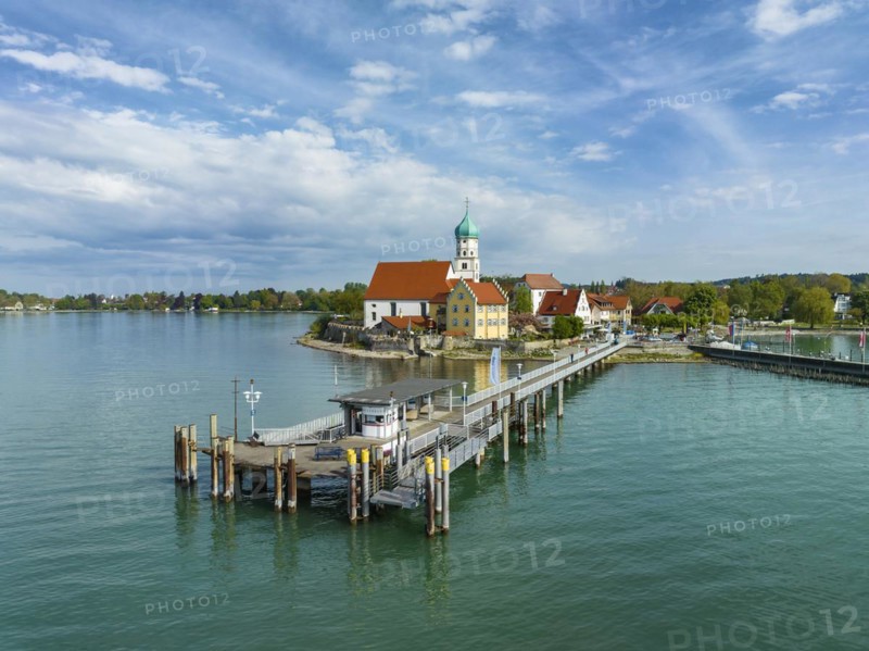 Aerial view of the moated castle peninsula on Lake Constance with the baroque church of St. George