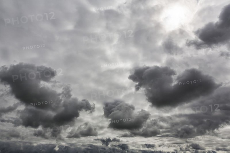 Sun shining through gap in clouds