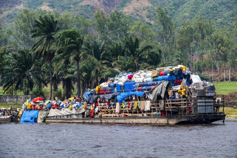 Overloaded riverboat on the Congo river