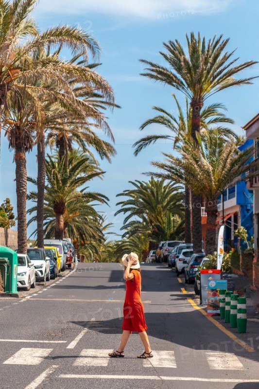 Tourist walking through the town of Valle Gran Rey on La Gomera