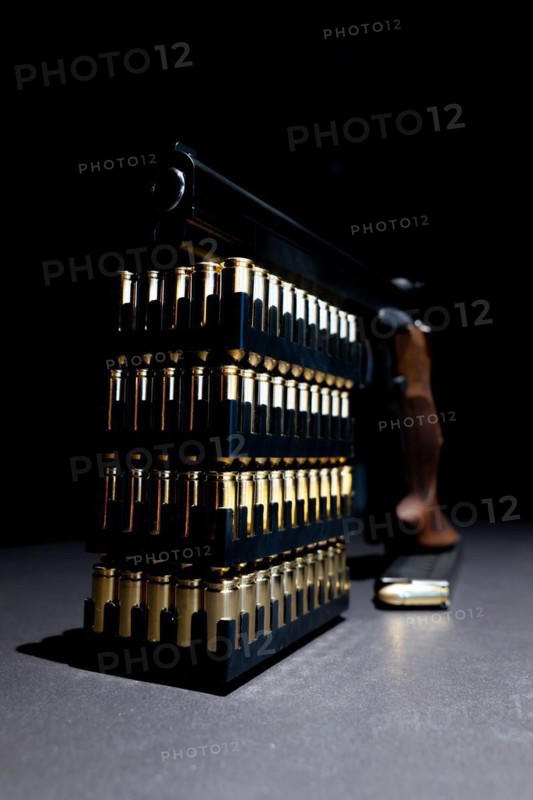 Elegant Semiautomatic 9mm Handgun Leaning on Bullet Ammunition in Switzerland