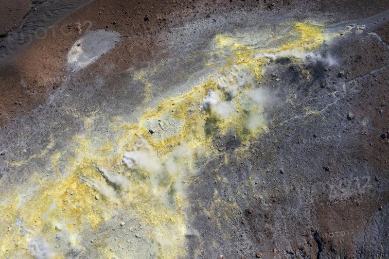 Smoking sulphur fumaroles at the crater rim