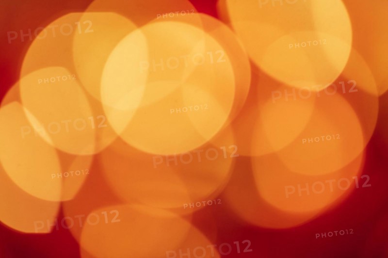Red tone blurs the bokeh light. Defocused Red and orange holiday bokeh. Abstract christmas background