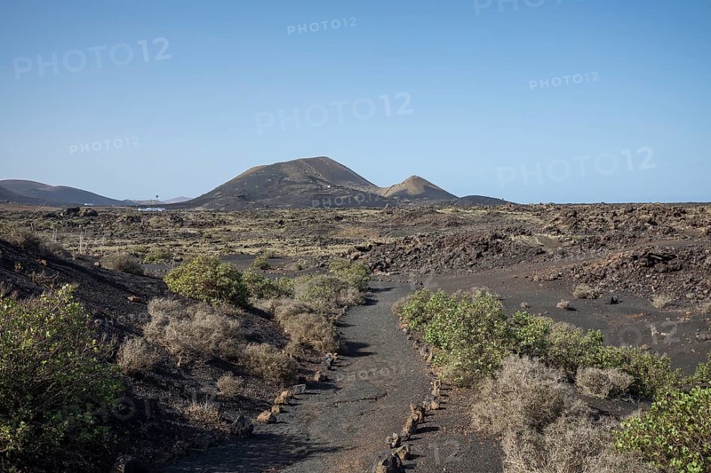 View of mountain range with volcanoes in Timanfaya National Park