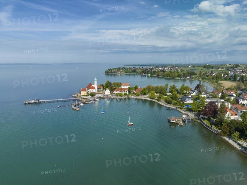 Aerial view of the moated castle peninsula on Lake Constance with the baroque church of St. George