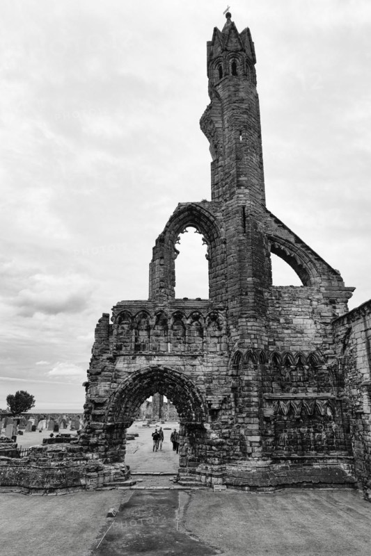 Tourists in front of ruined cathedral