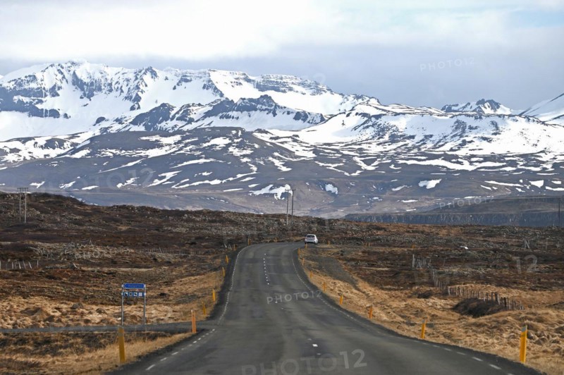 Road near Stykkisholmur in the north of the Snaefellsnes peninsula with view of snow-capped mountains