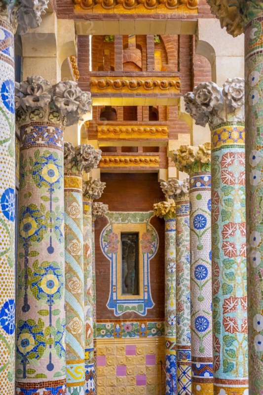 Columns with colourful mosaic on the outdoor terrace