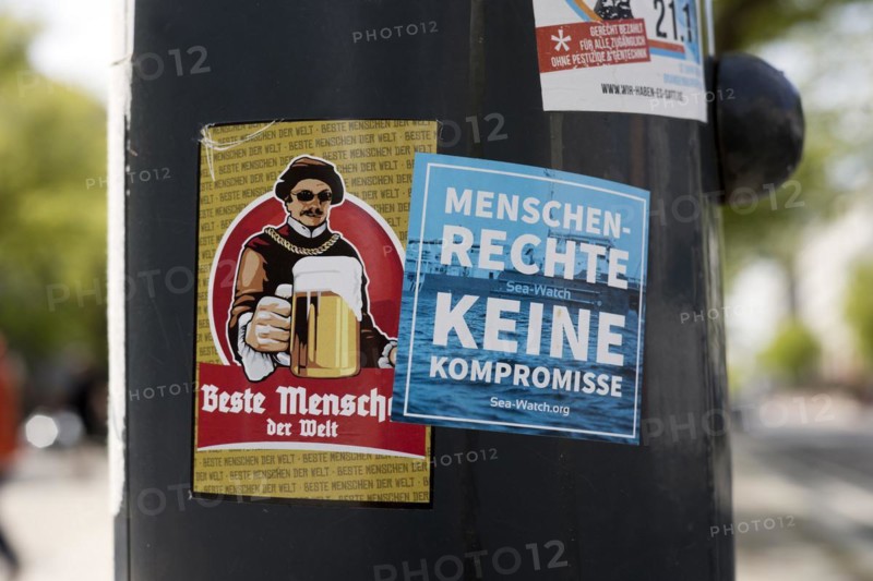 Sticker on a lamppost for Human Rights No Compromise