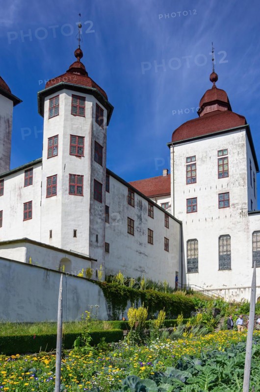 View of castle garden and baroque Laeckoe Castle on Kallandsoe in Vaenern in Vaestergoetland
