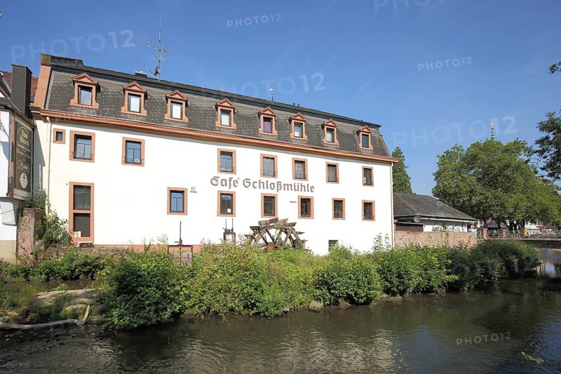 Cafe Schlossmuehle with mill wheel and brook Muemling