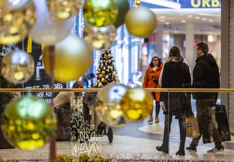 Christmas shopping under festive decorations