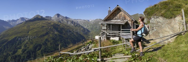Woman in front of Rainkarhuette in the Radstaetter Tauern