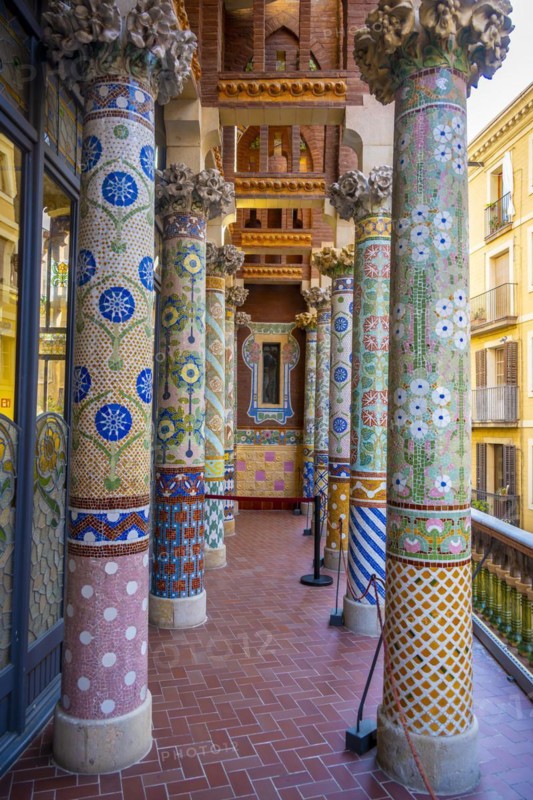 Columns with colourful mosaic on the outdoor terrace