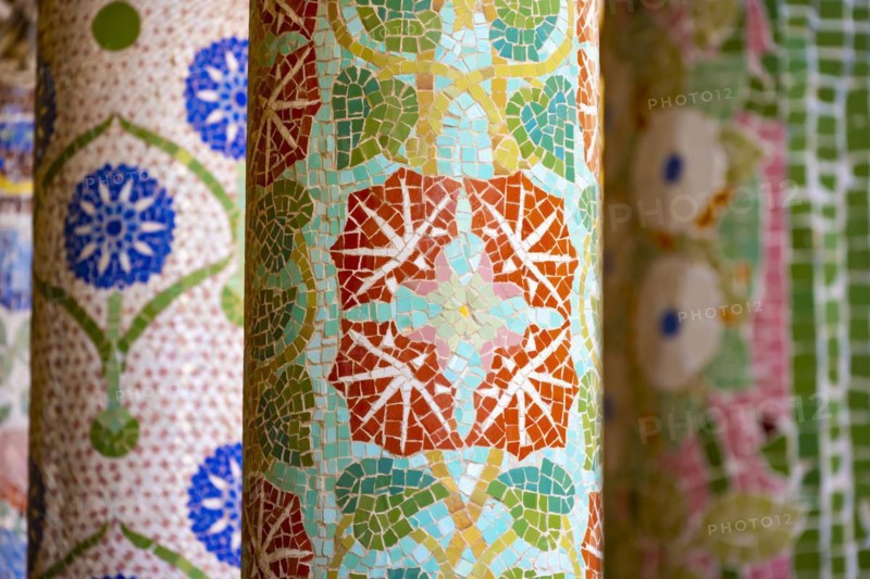 Columns with colourful mosaic on the outdoor terrace