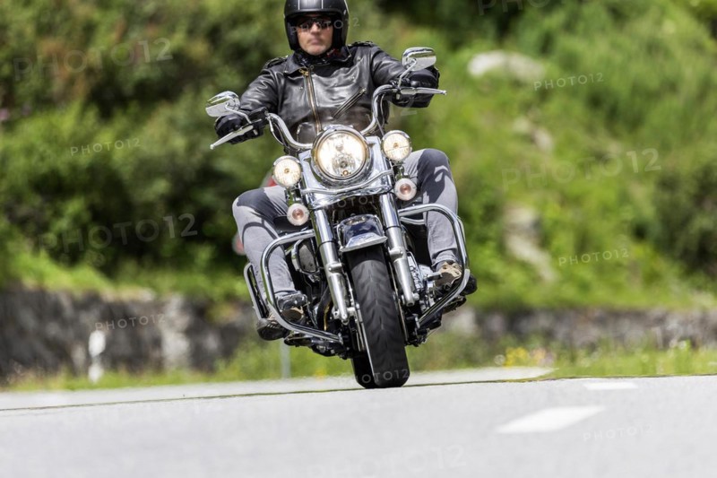Motorbike on the winding Nufenen Pass in the Alps