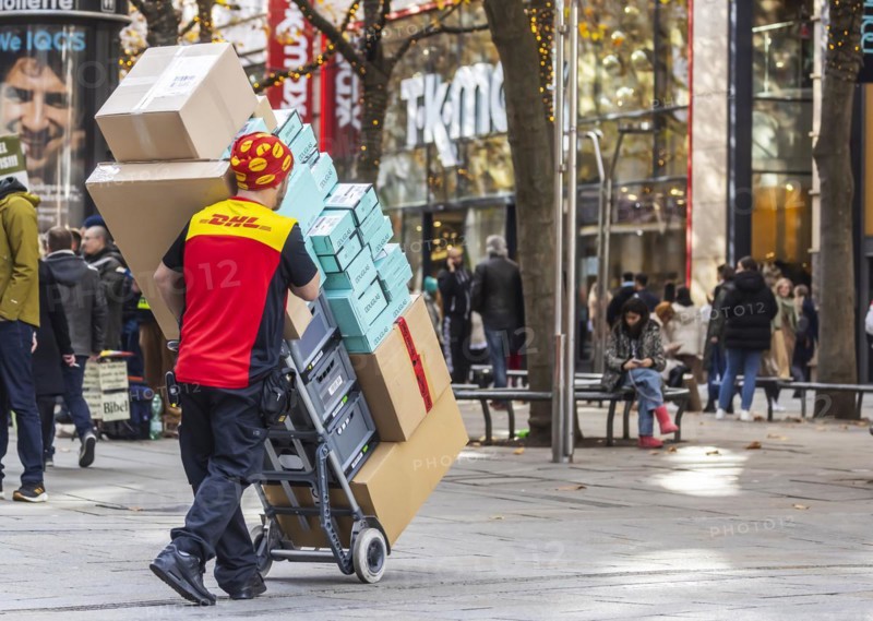 DHL parcel carrier with full trolley
