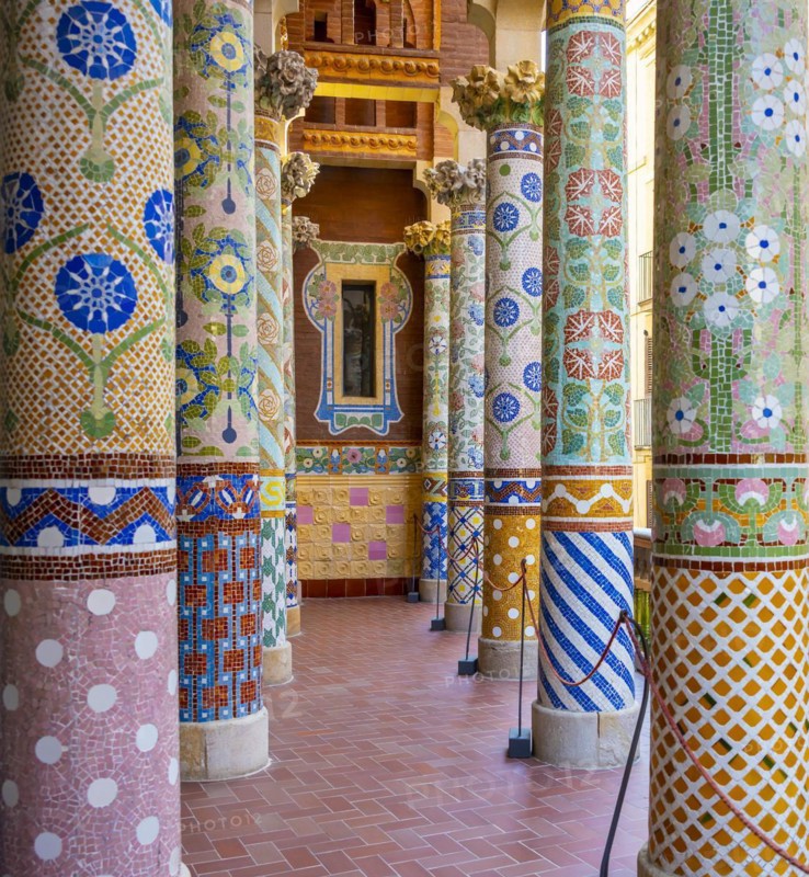 Columns with colourful mosaic on the outdoor terrace