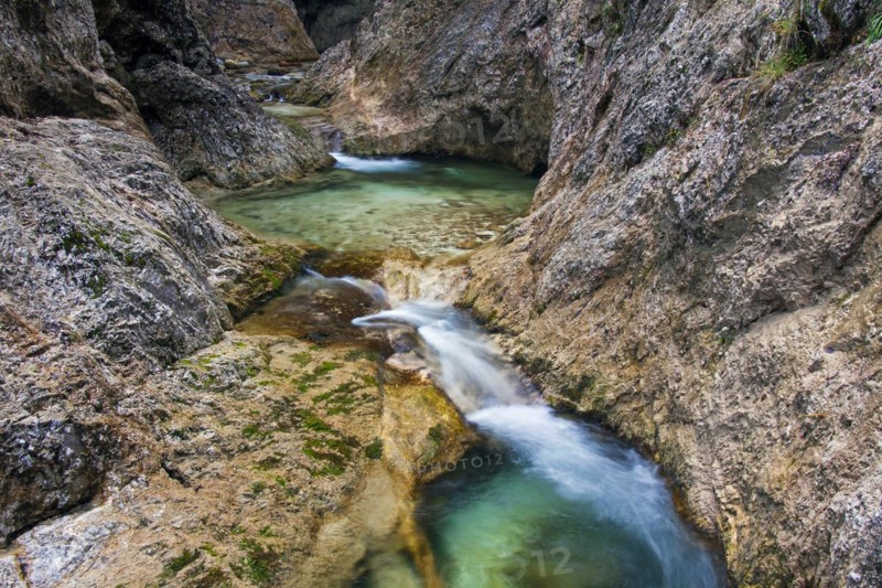 Waterfall in the river Almbach running through the Almbachklamm canyon in the Berchtesgaden Alps
