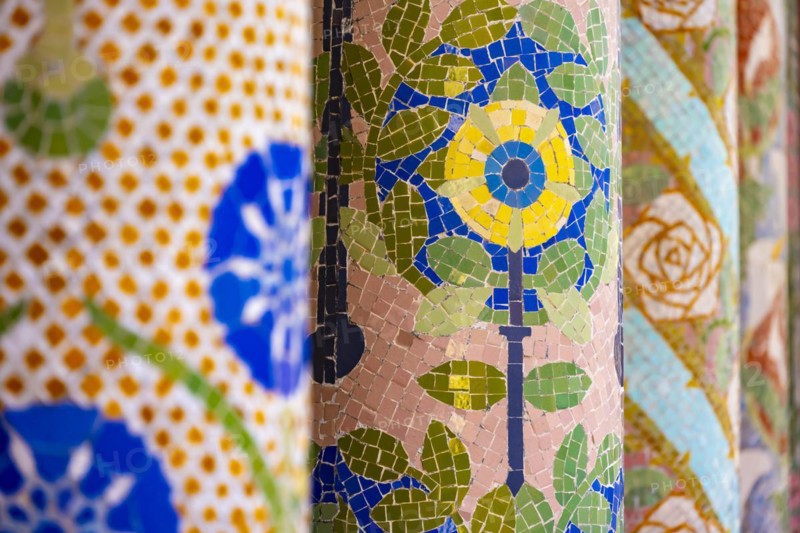 Columns with colourful mosaic on the outdoor terrace