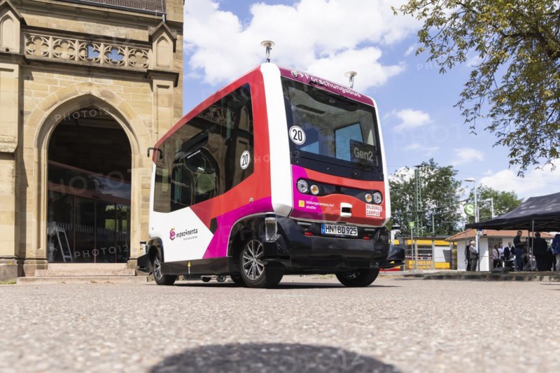 Autonomous minibus in front of the train station