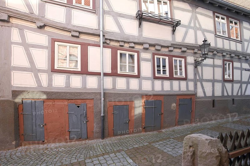 Facade of half-timbered house with doors