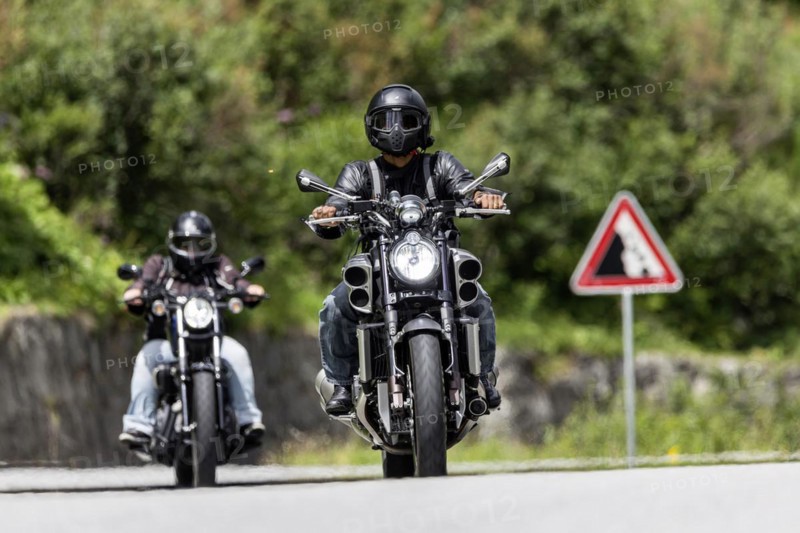 Motorbike on the winding Nufenen Pass in the Alps