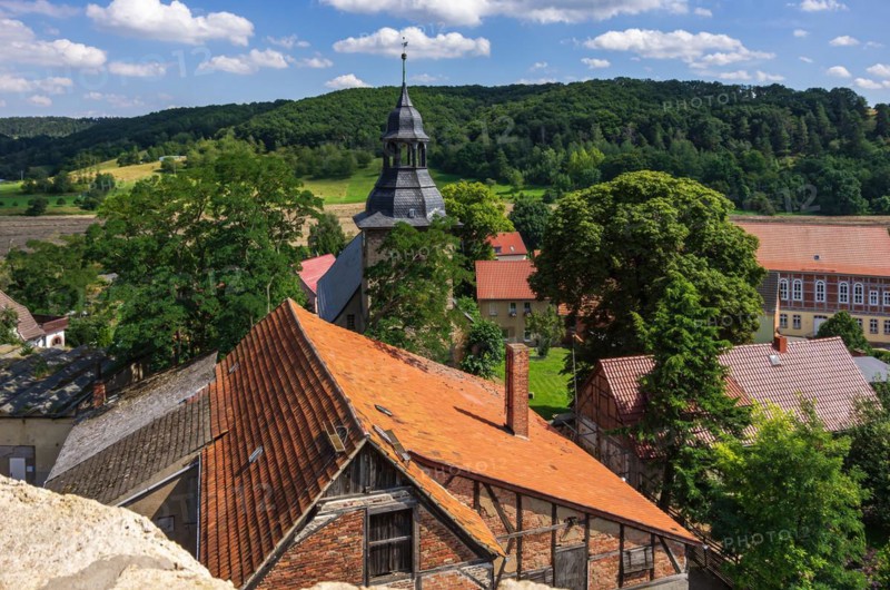 View from the west tower of the Romanesque monastery ruins of St. Wigbert on surrounding structures of the village of Goellingen near Bad Frankenhausen in Kyffhaeuserland