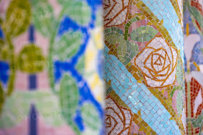 Columns with colourful mosaic on the outdoor terrace