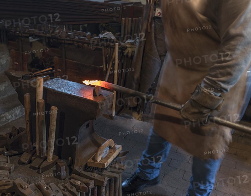 Iron is forged on an anvil