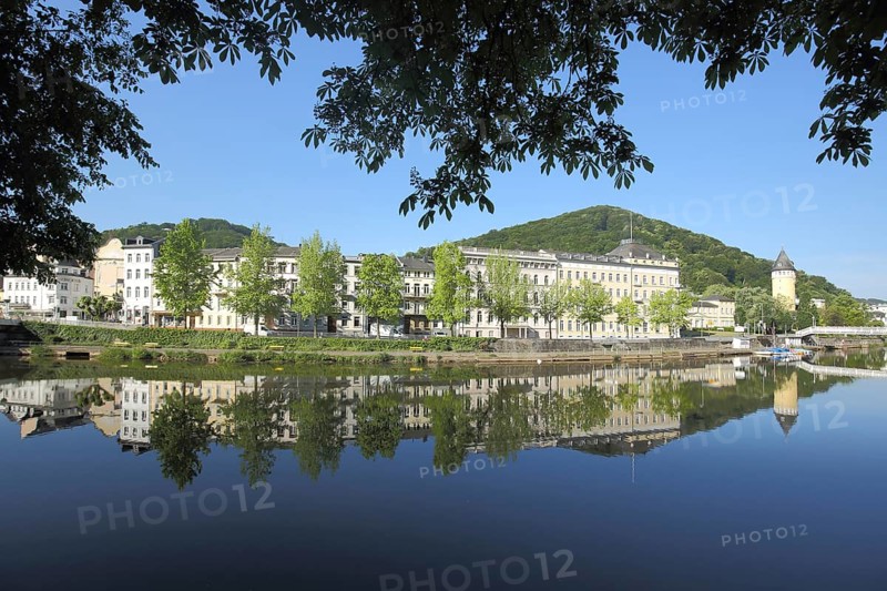 State Statistical Office on the banks of the Lahn and spring tower with reflection in the water